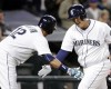 Seattle Mariners' Dae-Ho Lee, right, is congratulated by Leonys Martin on his home run against the Oakland Athletics during the fifth inning of a baseball game Friday, April 8, 2016, in Seattle. (AP Photo/Elaine Thompson)