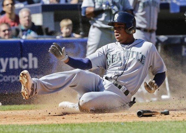 Seattle Mariners' Ketel Marte slides to score on an RBI double by Robinson Cano during the fifth inning of a baseball game against the New York Yankees Saturday, April 16, 2016, in New York. (AP Photo/Frank Franklin II)
