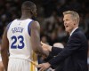 Golden State Warriors head coach Steve Kerr, right, talks to Golden State forward Draymond Green during the second half of an NBA basketball game against the San Antonio Spurs, Sunday, April 10, 2016, in San Antonio. Golden State won 92-86. (AP Photo/Darren Abate)