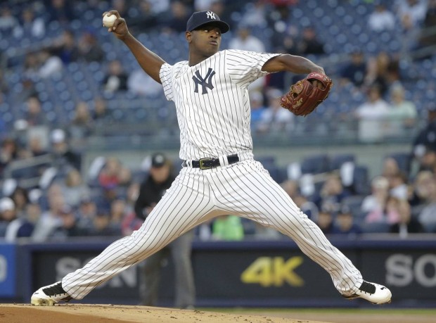 New York Yankees' Luis Severino delivers a pitch during the first inning of a baseball game against the Seattle Mariners on Friday, April 15, 2016, in New York. (AP Photo/Frank Franklin II)