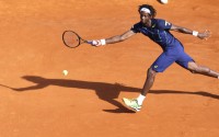 France's Gael Monfils plays a return to France's Jo-Wilfried Tsonga  during their semi final match of the Monte Carlo Tennis Masters tournament in Monaco, Saturday, April 16, 2016. (AP Photo/Lionel Cironneau)