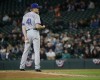 Texas Rangers pitcher Jake Diekman stands on the mound in the tenth inning of a baseball game against the Seattle Mariners, Wednesday, April 13, 2016, in Seattle. Later in the inning Diekman gave up a two-run walk-off home run to Seattle Mariners' Dae-Ho Lee, and the Mariners beat the Rangers 4-2 in tenth innings. (AP Photo/Ted S. Warren)