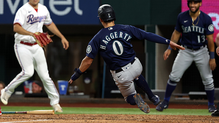 Seattle Mariners' Sam Haggerty rounds third base against against