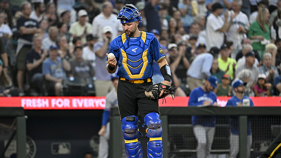 A Seattle Mariners fan wearing a Cal Raleigh jersey with Raleigh's