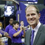 Mike Hopkins walks with his wife Tricia as he is introduced as Washington's new NCAA college basketball head coach, Wednesday, March 22, 2017, in Seattle. Hopkins, a longtime Syracuse assistant coach, replaces Lorenzo Romar. (AP Photo/Ted S. Warren)