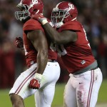 Alabama defensive lineman A'Shawn Robinson (86) celebrates his tackle of LSU running back Leonard Fournette (7) in the backfield with Alabama defensive lineman Jarran Reed (90) in the second half of an NCAA college football game Saturday, Nov. 7, 2015, in Tuscaloosa , Ala. (AP Photo/John Bazemore)