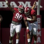 Alabama defensive lineman Jarran Reed (90) and Alabama defensive lineman Jonathan Allen (93) celebrate after Reed recovered a fumble during the first quarter of an NCAA college football game, Saturday, Sept. 12, 2015, at Bryant-Denny Stadium in Tuscaloosa, Ala. (Vasha Hunt/Alabama Media Group via AP)