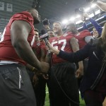 Alabama defensive lineman Jarran Reed, left,  jokes around with fellow defensive players for the TV camera during the media day for the NCAA Cotton Bowl college football game Tuesday, Dec. 29, 2015, in Arlington, Texas. (AP Photo/LM Otero)