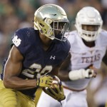In this Sept. 5, 2015, photo, Notre Dame running back C.J. Prosise runs with the ball during the first half of an NCAA college football game against Texas in South Bend, Ind. .Prosise believes he could play linebacker for Notre Dame, if needed. For now, though, the former defensive back and wide receiver is focusing on his ball-carrying skills and pass protection. (AP Photo/Nam Y. Huh)