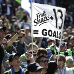 Fans hold a sign that reads "Fruit Snacks + 13 = Goals" in reference to Seattle Sounders forward Jordan Morris following an MLS soccer match between the Sounders and the Columbus Crew, Saturday, April 30, 2016, in Seattle. Morris had the winning goal as the Sounders beat the Crew 1-0. (AP Photo/Ted S. Warren)