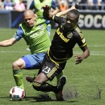 Columbus Crew's Kei Kamara, right, is fouled by Seattle Sounders' Osvaldo Alonso, left, in the first half of an MLS soccer match, Saturday, April 30, 2016, in Seattle. (AP Photo/Ted S. Warren)