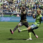 Seattle Sounders' Chad Marshall, right, gets the ball past Columbus Crew's Kei Kamara, left, in the first half of an MLS soccer match, Saturday, April 30, 2016, in Seattle. The Sounders beat the Crew 1-0.(AP Photo/Ted S. Warren)
