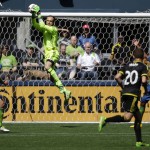 Seattle Sounders goalkeeper Stefan Frei, second from left, leaps for the ball in the second half of an MLS soccer match against the Columbus Crew, Saturday, April 30, 2016, in Seattle. The Sounders beat the Crew 1-0. (AP Photo/Ted S. Warren)