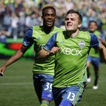 Seattle Sounders' Jordan Morris, right, and Oalex Anderson, left, celebrate after Morris scored the winning goal against the Columbus Crew in the second half of an MLS soccer match, Saturday, April 30, 2016, in Seattle. The Sounders beat the Crew 1-0. (AP Photo/Ted S. Warren)
