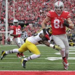 Ohio State tight end Nick Vannett, right, scores a touchdown past Michigan defensive back Dymonte Thomas during the first quarter of an NCAA college football game Saturday, Nov. 29, 2014, in Columbus, Ohio. (AP Photo/Jay LaPrete)