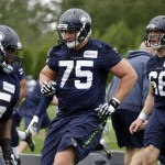 Seattle Seahawks' Patrick Lewis (65), Will Pericak (75) and Justin Britt run through drills at NFL football practice Thursday, May 26, 2016, in Renton, Wash. (AP Photo/Elaine Thompson)