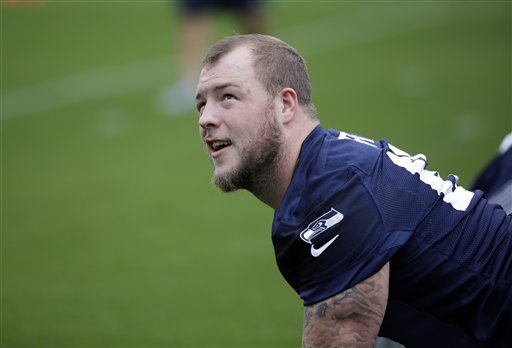 Seattle Seahawks' Justin Britt stretches during drills at an NFL football practice Thursday, May 26...