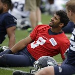 Seattle Seahawks quarterback Russell Wilson stretches at an NFL football practice Thursday, May 26, 2016, in Renton, Wash. (AP Photo/Elaine Thompson)
