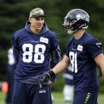 Seattle Seahawks' Jimmy Graham (88) chats with Nick Vannett at an NFL football practice Thursday, May 26, 2016, in Renton, Wash. (AP Photo/Elaine Thompson)