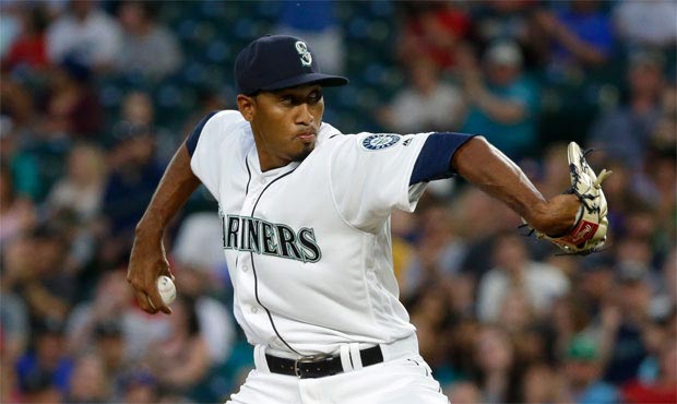Mariners closer Edwin Diaz, nicknamed Sugar, walks out to Def Leppard's "Pour Some Sugar On Me." (A...