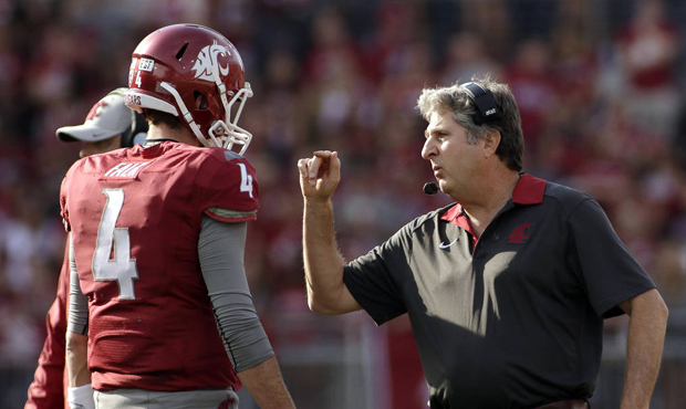 WSU coach Mike Leach says NFL scouts wrongly discount quarterbacks coming from spread offenses. (AP...