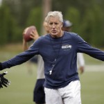 Seattle Seahawks head coach Pete Carroll motions to players during the team's NFL football training camp Saturday, July 30, 2016, in Renton, Wash. (AP Photo/Elaine Thompson)