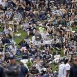 Seattle Seahawks' fans fill a hillside as they look on during the team's NFL football training camp Saturday, July 30, 2016, in Renton, Wash. (AP Photo/Elaine Thompson)