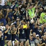 Seattle Seahawks fans cheer in the second half of a preseason NFL football game against the Dallas Cowboys, Thursday, Aug. 25, 2016, in Seattle. (AP Photo/Stephen Brashear)