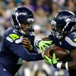 Seattle Seahawks quarterback Trevone Boykin, left, hands off to running back Alex Collins, right, in the second half of a preseason NFL football game against the Minnesota Vikings, Thursday, Aug. 18, 2016, in Seattle. (AP Photo/Elaine Thompson)