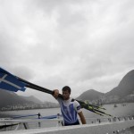 
              Rowers from Greece remove their boat from the water after a rowing training session during the 2016 Summer Olympics in Rio de Janeiro, Brazil, Wednesday, Aug. 10, 2016. Rowing competition was postponed Wednesday due to weather. (AP Photo/Gregory Bull)
            