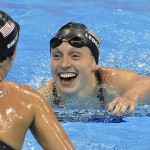 
              United States' Katie Ledecky, right, celebrates with United States' Leah Smith after setting a new world record in the women's 400-meter freestyle final during the swimming competitions at the 2016 Summer Olympics, Sunday, Aug. 7, 2016, in Rio de Janeiro, Brazil. (AP Photo/Martin Meissner)
            