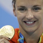 
              Hungary's Katinka Hosszu shows off her gold medal for the women's 200-meter individual medley final during the swimming competitions at the 2016 Summer Olympics, Wednesday, Aug. 10, 2016, in Rio de Janeiro, Brazil. (AP Photo/Michael Sohn)
            