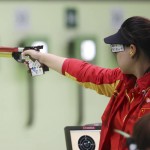 
              Zhang Mengxue of China competes during the women's 10-meter air pistol qualification at Olympic Shooting Center at the 2016 Summer Olympics in Rio de Janeiro, Brazil, Sunday, Aug. 7, 2016. Zhang won the gold medal for the event. (AP Photo/Eugene Hoshiko)
            