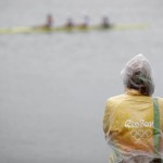 
              An official wears a rain cover during a rowing training session at the 2016 Summer Olympics in Rio de Janeiro, Brazil, Wednesday, Aug. 10, 2016. Rowing competition was postponed Wednesday due to weather. (AP Photo/Gregory Bull)
            