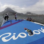
              Rowers who were training return to shore after high winds postponed their competition for the day at the 2016 Summer Olympics in Rio de Janeiro, Brazil, Sunday, Aug. 7, 2016.(AP Photo/Luca Bruno)
            