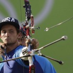 
              Zach Garrett of the United States releases his arrow during the men's team archery competition at the Sambadrome venue during the 2016 Summer Olympics in Rio de Janeiro, Brazil, Saturday, Aug. 6, 2016.(AP Photo/Natacha Pisarenko)
            