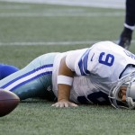 
              Dallas Cowboys quarterback Tony Romo lies on the turf after he went down on a play against the Seattle Seahawks during the first half of a preseason NFL football game, Thursday, Aug. 25, 2016, in Seattle. (AP Photo/Elaine Thompson)
            