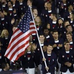 
              Michael Phelps carries the flag of the United States during the opening ceremony for the 2016 Summer Olympics in Rio de Janeiro, Brazil, Friday, Aug. 5, 2016. (AP Photo/Matt Slocum)
            