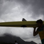 
              The Christ the Redeemer statue is hidden by clouds over the mountain as a rower carries his boat before competition begins at the rowing venue at Lagoa at the 2016 Summer Olympics in Rio de Janeiro, Brazil, Monday, Aug. 8, 2016. (AP Photo/David Goldman)
            