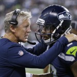 Seattle Seahawks coach Pete Carroll, left, talks with backup quarterback Trevone Boykin during the second half of a preseason NFL football game against the Dallas Cowboys, Thursday, Aug. 25, 2016, in Seattle. (AP Photo/Elaine Thompson)