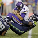 Minnesota Vikings quarterback Joel Stave (2) is sacked by Seattle Seahawks defensive end Frank Clark, right, and defensive tackle Quinton Jefferson (99) during the second half of a preseason NFL football game, Thursday, Aug. 18, 2016, in Seattle. (AP Photo/John Froschauer)