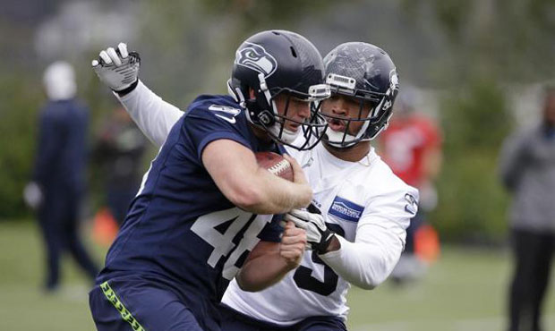 Nolan Frese, left, is the third long-snapper Seattle has looked at since releasing Clint Gresham in...