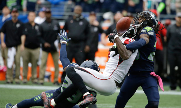 Officials didn't flag Richard Sherman for pass interference on Atlanta's final play, though they co...