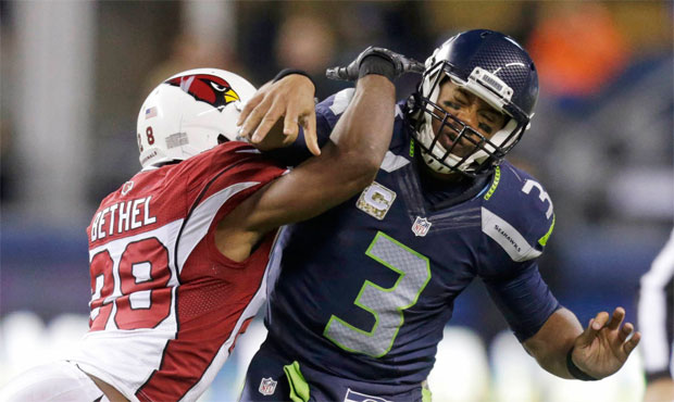 Russell Wilson and the Seahawks have had mixed results against Arizona's blitz-heavy defense. (AP)...