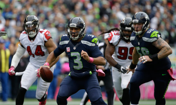 Russell Wilson's diminished mobility explains some of the deficiencies in Seattle's running game. (...