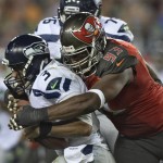 Tampa Bay Buccaneers defensive tackle Gerald McCoy (93) sacks Seattle Seahawks quarterback Russell Wilson (3) during the fourth quarter of an NFL football game Sunday, Nov. 27, 2016, in Tampa, Fla. The Buccaneers won the game 14-5. (AP Photo/Jason Behnken)