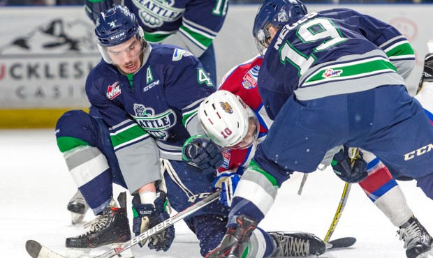 Turner Ottenbreit and Donovan Neuls fight for the puck during Seattle's 5-2 win over Edmonton (Bria...