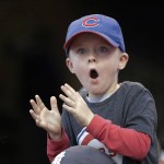 
              Six-year-old Sam Hollingsworth of Chicago of Chicago watches batting practice before Game 7 of the Major League Baseball World Series between the Cleveland Indians and the Chicago Cubs Wednesday, Nov. 2, 2016, in Cleveland. (AP Photo/David J. Phillip)
            