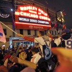 
              Chicago Cubs fans celebrate in front of Wrigley Field in Chicago on Wednesday, Nov. 2, 2016, after the Cubs defeated the Cleveland Indians 8-7 in Game 7 of the baseball World Series in Cleveland. (AP Photo/Charles Rex Arbogast)
            