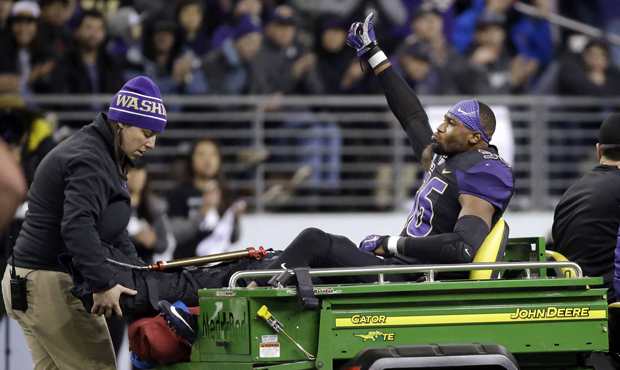 Azeem Victor suffered a fracture in his right leg in Washington's loss to USC on Saturday. (AP)...